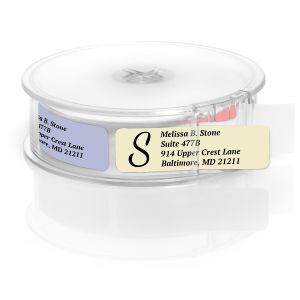 A white paper roll of stonewashed address labels featuring a clean four-line layout template and a prominent black letter S initial monogram.