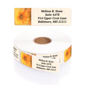 A personalized return address label with a vibrant, bright golden sunflower graphic on the left, shown above its matching rolled label pack.