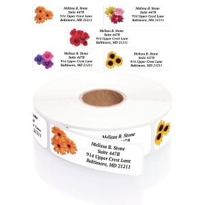A roll of custom floral address labels emerging from a clear plastic dispenser, displayed beneath five distinct colorful flower designs.