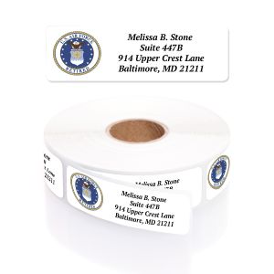 A paper roll of Air Force Retired address labels showcasing the official blue and gold military service crest beside a clean four-line typography layout.