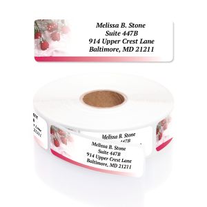 Single personalized address label featuring romantic red rose motifs displayed above a rolled coil of return address labels.