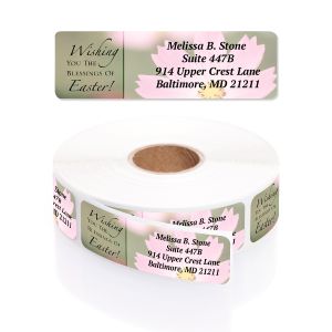 Single personalized address label with Easter floral artwork displayed above a rolled coil of printed return address stickers.