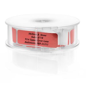 A paper roll of shiny red foil return address labels featuring an elegant serif typography layout template on a clean white background.