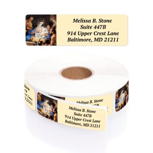 A paper roll of Away In A Manger address labels showcasing a classic Nativity scene painting beside a clean four-line typography layout template.