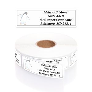 Single personalized address label featuring a cute penguin illustration displayed above a rolled coil of return address labels.