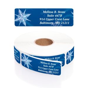 A white paper roll of winter address labels featuring a detailed blue snowflake design and a clean four-line typography layout template.
