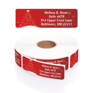 Jesus Shines address label displayed above a roll of personalized red return address stickers featuring a festive Christmas tree graphic.