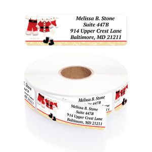 A roll of personalized Yuletide Laundry address labels featuring Santa Claus suits on a clothesline above custom name and address text.