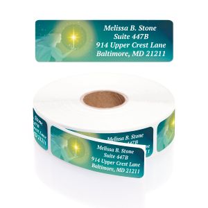 Close-up view of a roll of personalized Christmas Lighting address labels featuring a glowing star and soft green festive backdrop.