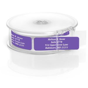 A paper roll of vibrant purple address labels featuring a crisp white typography layout template, housed inside a clear round plastic dispenser.