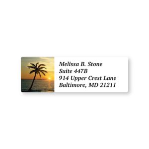 A rectangular personalized address label featuring a scenic tropical beach sunset with a silhouette of a single palm tree on the left.