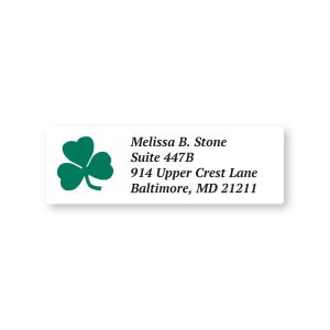A rectangular personalized address label featuring a vibrant green three-leaf shamrock illustration next to clean, elegant custom text.