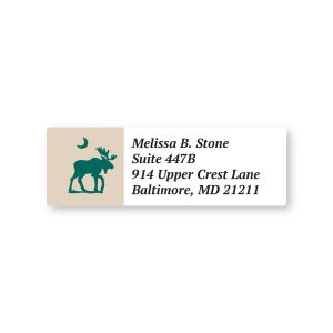 Close-up view of a personalized Moose sheeted address label displaying sample name and address text next to a green moose and moon graphic.