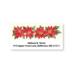 Close-up of a personalized Poinsettia address label featuring a row of red Christmas flowers across the top and two lines of custom text.