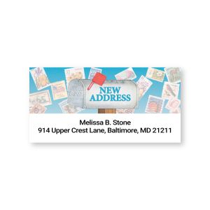 Personalized Just Moved address label featuring a silver mailbox with a red flag, new address graphic, and sample return address text.