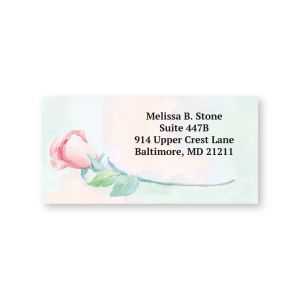 Single sheeted address label featuring a soft pink watercolor rose illustration alongside sample custom return address text.
