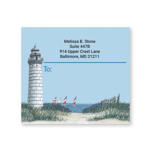Square shipping label featuring a scenic lighthouse and sailboat illustration with custom return address and designated recipient area.