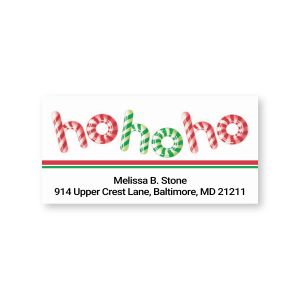 Rectangular holiday address label featuring candy cane patterned ho ho ho lettering above green and red accent lines and custom text.