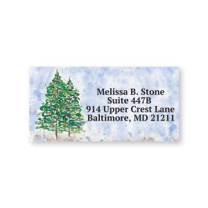 Close-up of a personalized Winter Watercolor address label with a snowy evergreen tree graphic and custom four-line address text.