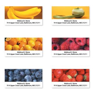 Six personalized fruit return address labels featuring bananas, oranges, berries, and citrus images with custom name and address.