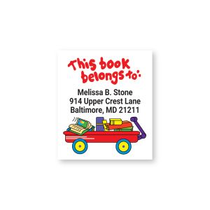 Close-up view of a personalized Lil Wagon sheeted bookplate label displaying custom name and address text above a red toy wagon.