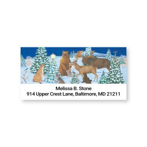 Close-up view of a personalized Peaceful Forest address label featuring forest animals in a snowy scene with custom name and address.
