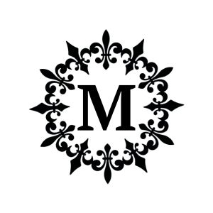 Ornate circular monogram design featuring an intricate fleur-de-lis floral frame enclosing a large capital letter M in the center.