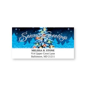 Rectangular holiday address label featuring a starry night sky and snowy pine tree with script reading 