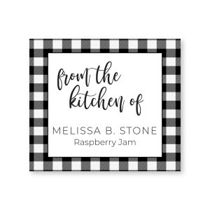 Square canning label featuring a black and white buffalo plaid border around From the Kitchen Of text and two lines of custom personalization.