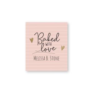 Pink and gold striped goodie label reading 'Baked With Love' flanked by small gold hearts, with personalized name printed below.