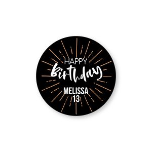 Round personalized birthday label with gold fireworks on black background reading 