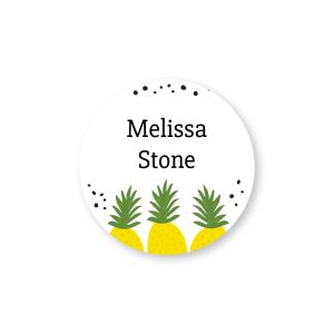Personalized round water-resistant name label featuring three bright yellow pineapples along the bottom border and custom owner name text.