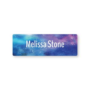 Rectangular water-resistant name label featuring a blue and purple space galaxy background printed with custom text reading 