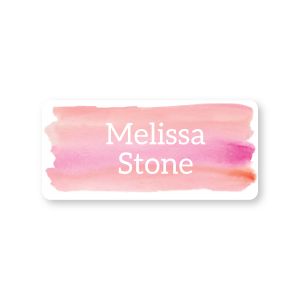 Small rectangular water-resistant name label featuring a pink watercolor background printed with custom white text reading 