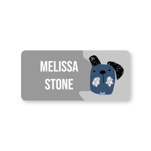 Small grey water-resistant name label featuring a blue cute puppy illustration beside customized white text reading MELISSA STONE.
