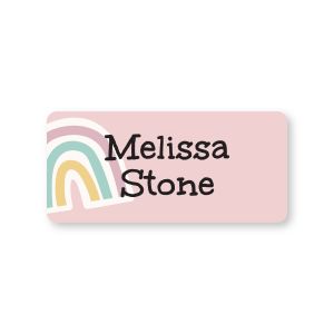 Small rectangular pink name label featuring a pastel rainbow illustration and custom black text reading 