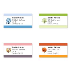 A grid of four seasonal address labels featuring beautifully illustrated winter, spring, summer, and autumn trees next to custom text fields.