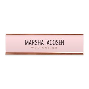 Personalized blush pink desk plate held in a metallic rose gold metal frame displaying custom printed name and professional title text.