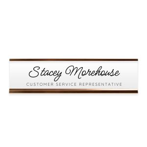 Rectangular personalized desk name plate in a rose gold metal stand reading 