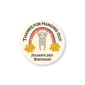 Round party sticker featuring a cute sloth hanging from a rainbow, reading 
