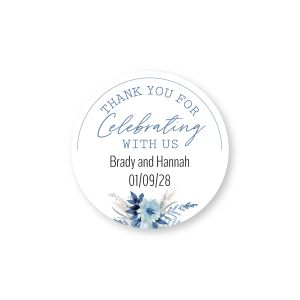 Round sticker reading Thank You For Celebrating With Us with a blue floral arrangement and two lines of custom name and date text.