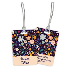 Double-sided plastic luggage tag displaying a vibrant modern floral design on one side and personalized contact details on the back.