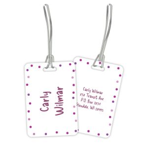 Double-sided rectangular pink polka dot plastic luggage tag with clear flexible loop straps showing both personalized front and back side details.