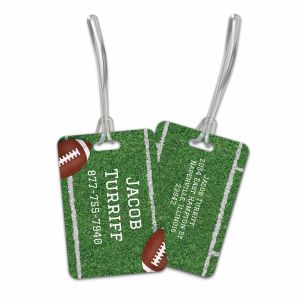Pair of football-themed luggage tags showing front design with yard lines and football alongside back side with custom contact details.