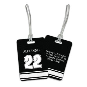 Black and white personalized sports jersey luggage tag set displaying front player name and number next to back contact information.