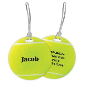 Front and back view of a round yellow tennis ball bag tag with a plastic strap, featuring personalized text on both sides.
