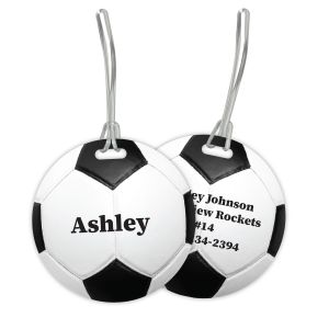 Front and back view of a round soccer ball plastic luggage tag with custom printed name Ashley on front and contact details on back.