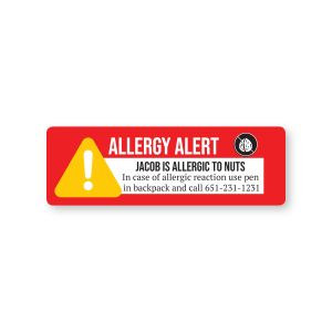 Rectangular red nut allergy alert label with peanut icon, reading 