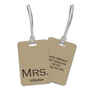 Double-sided tan plastic luggage tag featuring 'MRS.' with a custom last name on front and four customizable contact info lines on back.