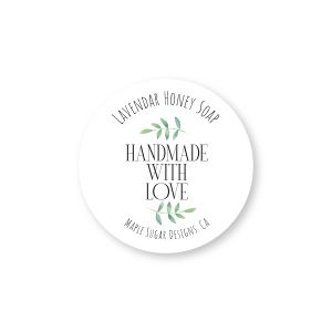 Round product sticker featuring green leaf sprigs, reading 